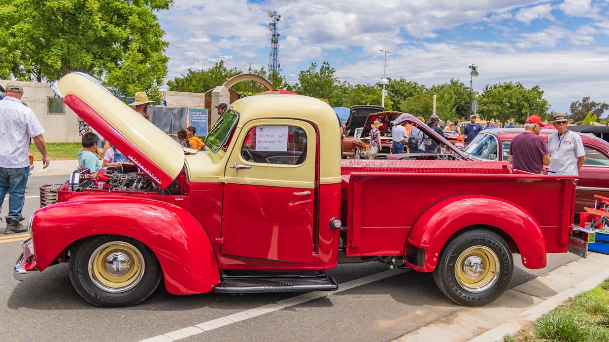 Red pickup truck parked on the street — one of the most stolen vehicles