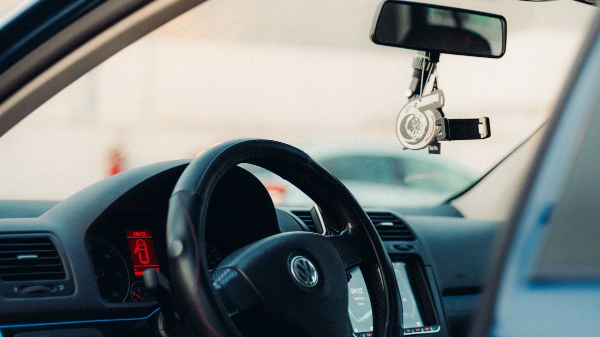 Close-up of a car interior and steering wheel — brake pedal lock to stop car theft