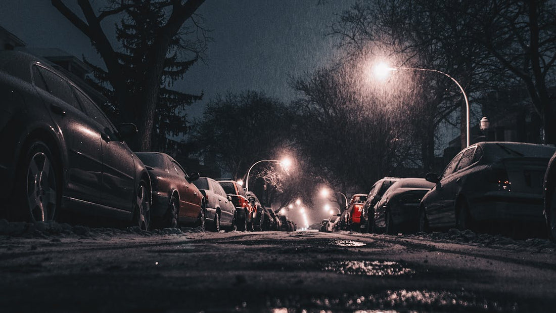 Cars parked on a city street at night — car theft risk in America