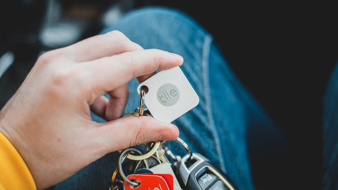 Person holding a car key — layered vehicle security to prevent theft